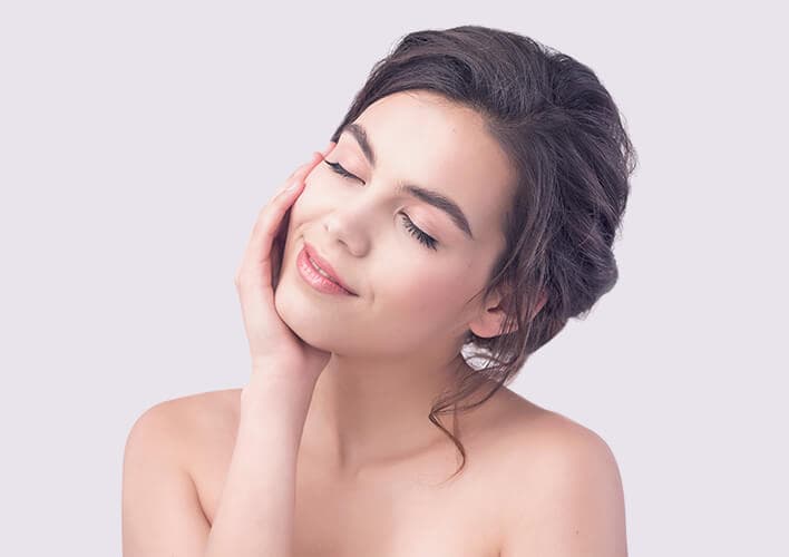 Woman relaxing during a spa facial